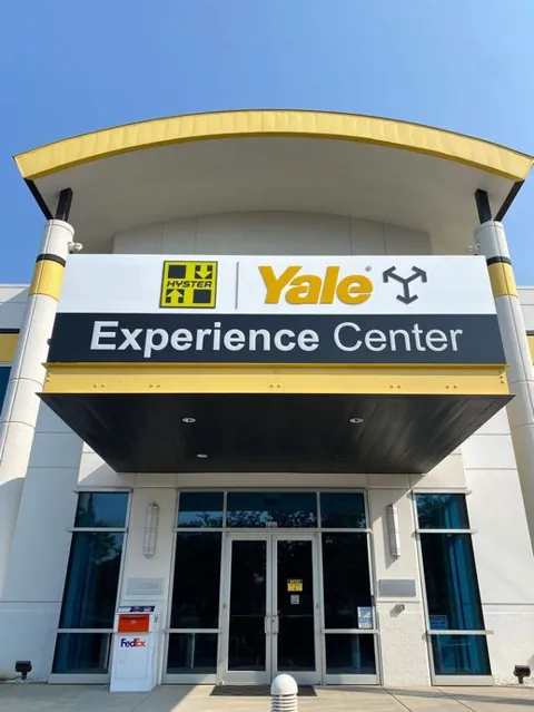Tall freestanding business sign with tenant identification panels