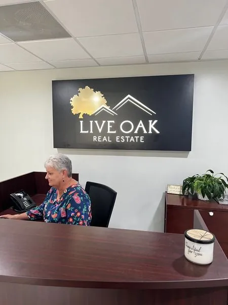 Dimensional logo sign behind an office reception desk